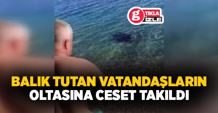 Antalya’da Konyaaltı sahilinde balık tutan iki arkadaşın oltasına bir erkek