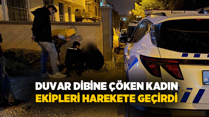 Adıyaman’da, duvar dibine çökerek karanlıkta duran yüzü kapalı kadın, polis