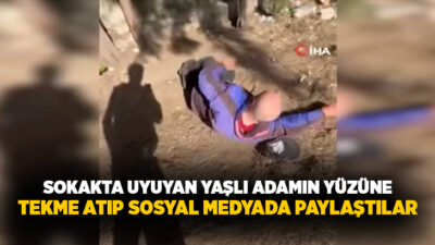 İzmir'in Buca ilçesinde sokakta uyuyan yaşlı bir adamı uyandırarak dalga