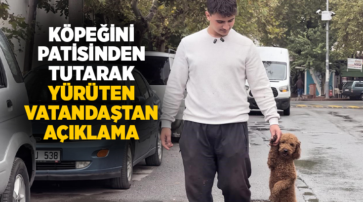 Manisa'nın Akhisar ilçesinde, köpeğini ön patisinden tutarak yürüttüğü anlara ait
